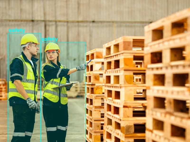 Warehouse workers identified with safety bounding boxes